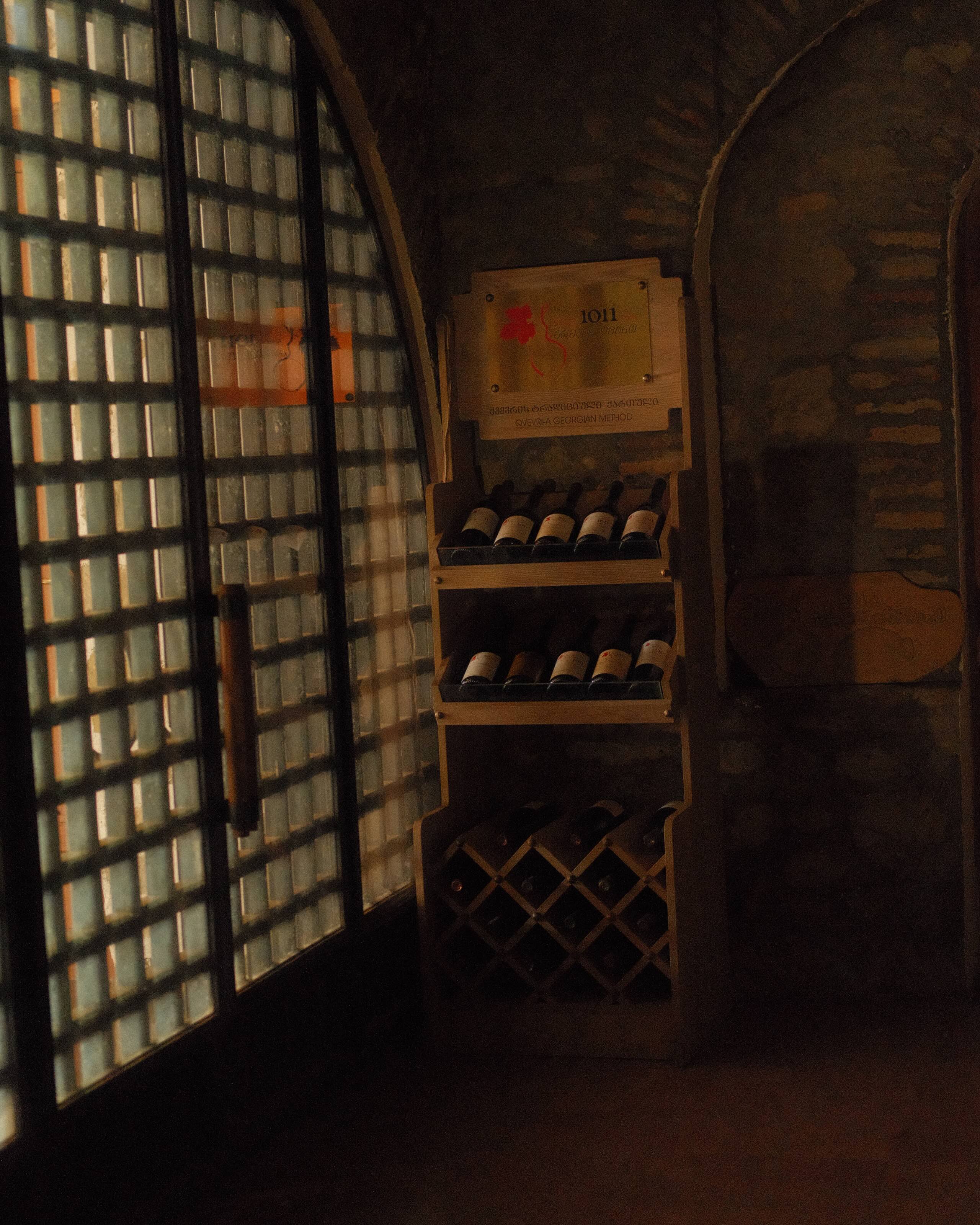 A monk tending qvevri in Alaverdi Monastery’s historic cellar